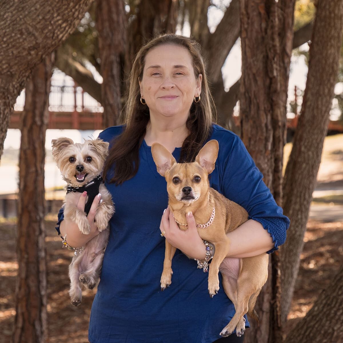 Jennifer Atchley Holding Two Dogs